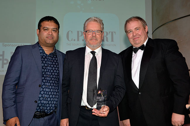 C.P. Hart's MD collecting the Multiple Retailer of the Year Award
